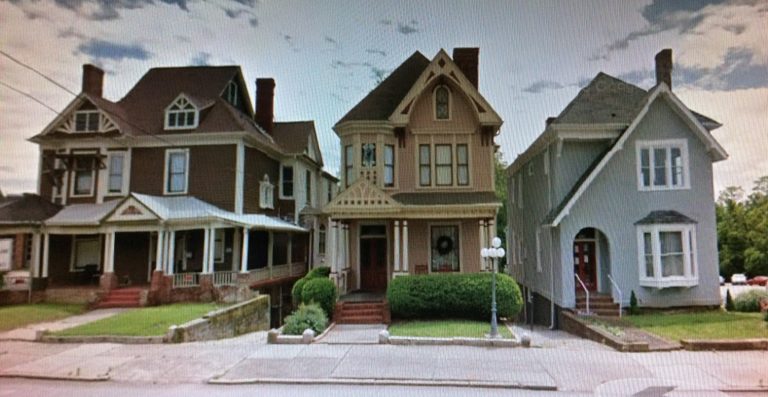 The two homes on the right were originally built in the same style; the one on the right was altered over time